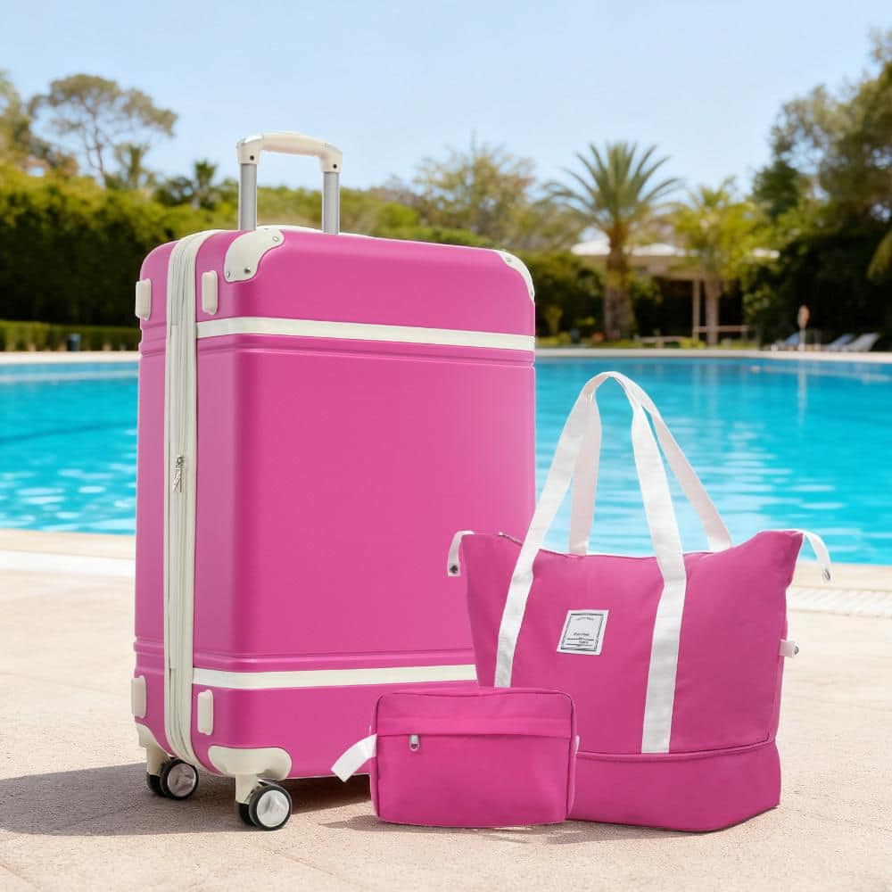 3-Piece Pink ABS Hardshell Double Spinner 28in. Luggage Set with an Expandable Travel Duffel Bag, a Toiletry Bag