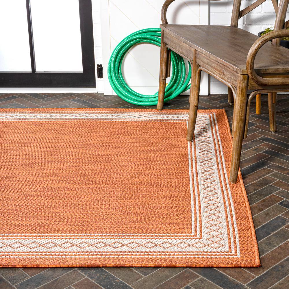 Lucia Cream and Orange Synthetic Indoor/Outdoor Area Rug
