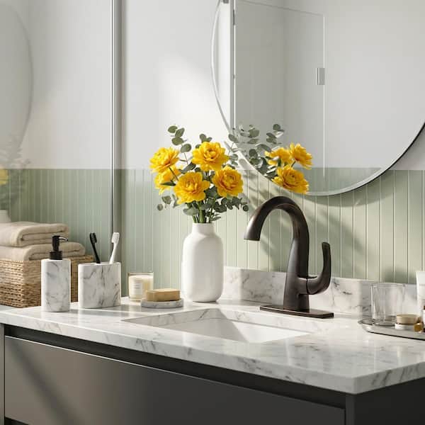 Single Handle Bathroom Faucet with Deckplate Included in Oil Rubbed Bronze