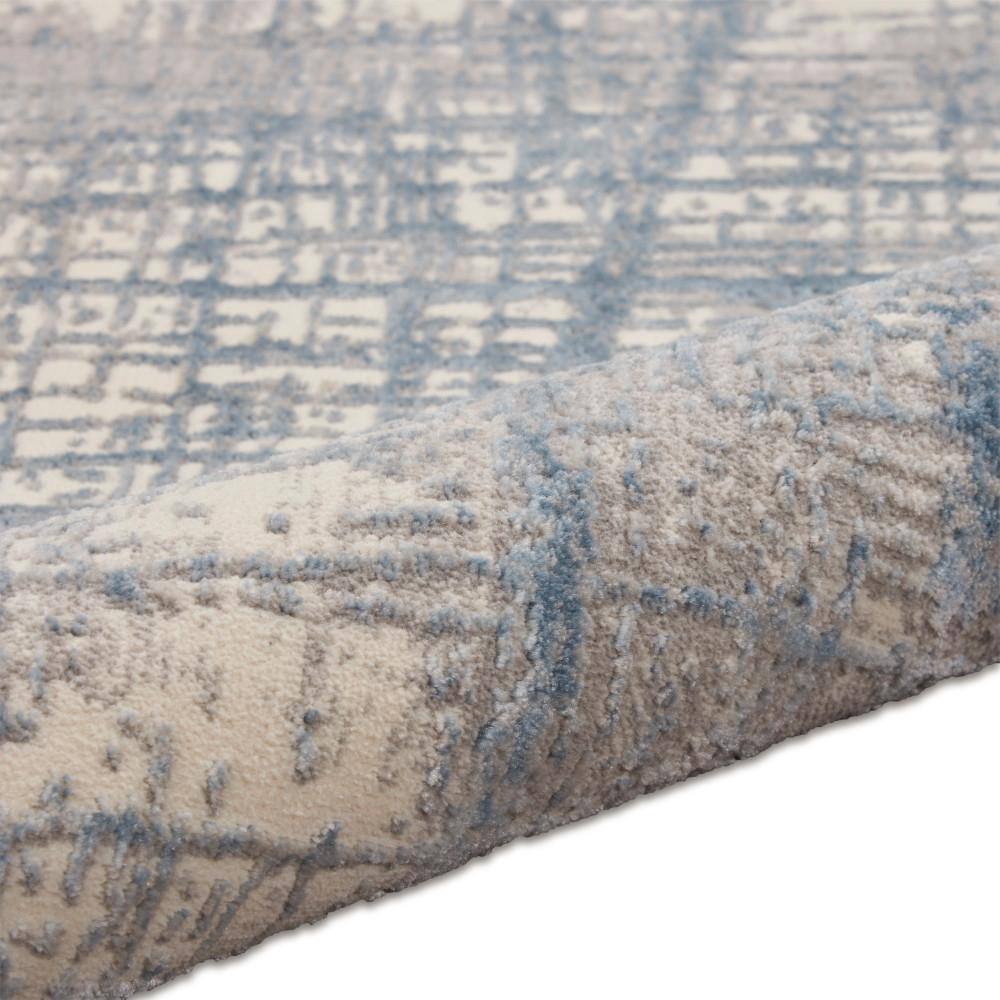 Ivory Blue Abstract 5' x 7' Synthetic Area Rug