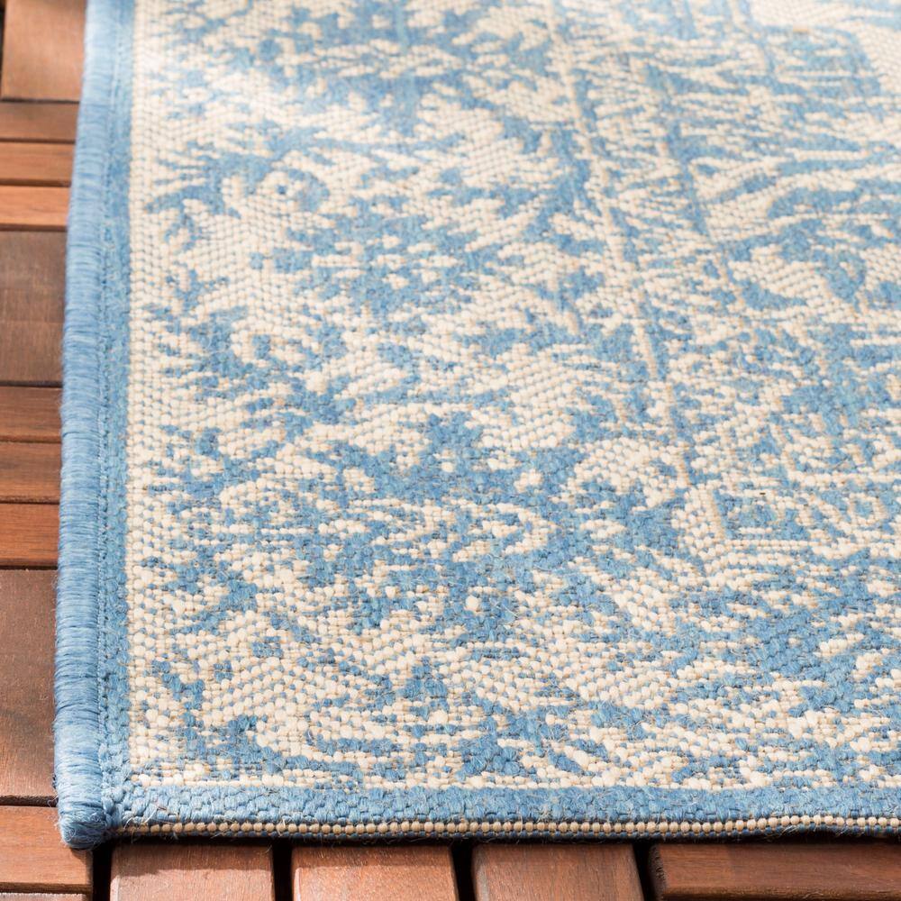 Cream and Blue Round Stain-Resistant Synthetic Rug