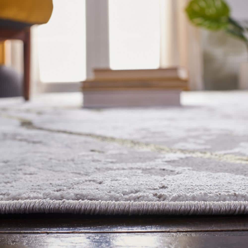 Amelia 5' Round Grey and Gold Abstract Synthetic Rug