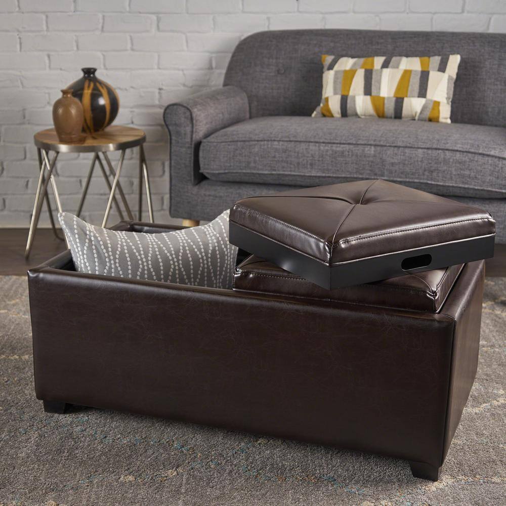 Brown storage ottoman with one lid partially open, showing a pillow inside.