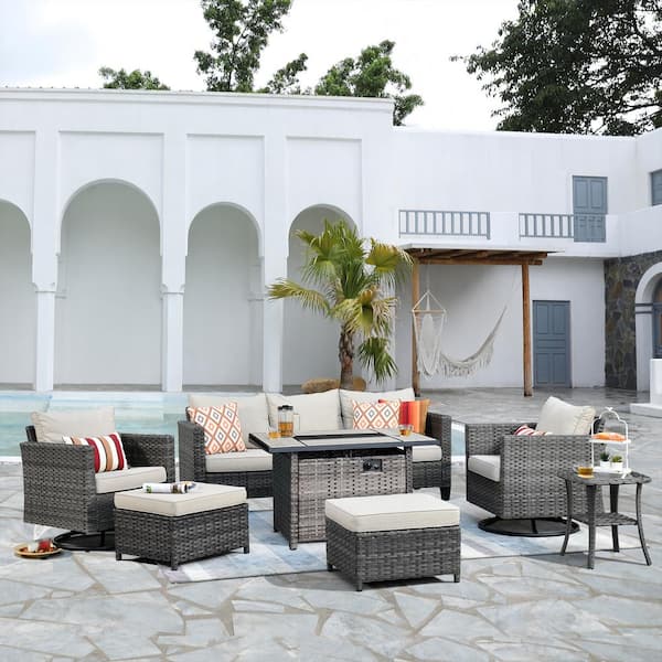 XIZZI Hyperion 7-Piece Wicker Patio Rectangular Fire Pit Set and with Beige Cushions and Swivel Rocking Chairs