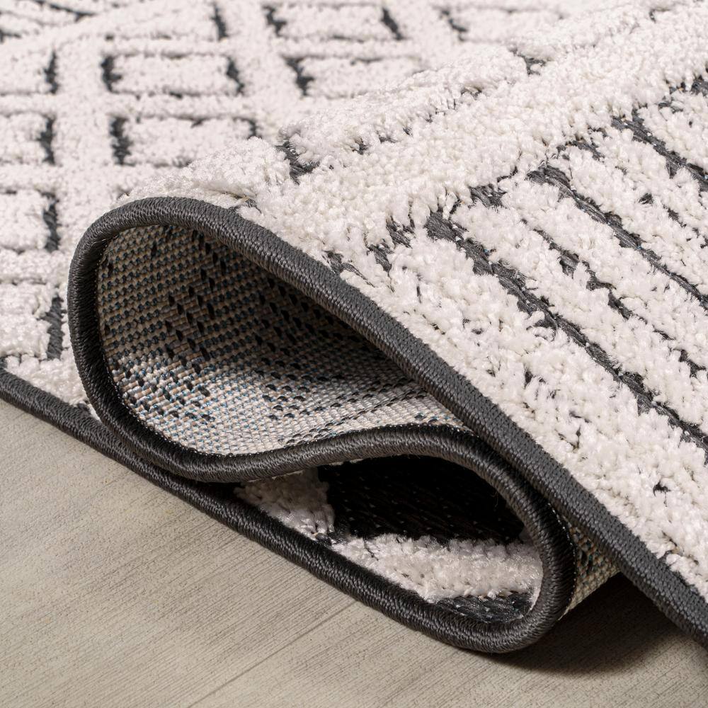 Cream and Black Geometric Synthetic Indoor/Outdoor Area Rug