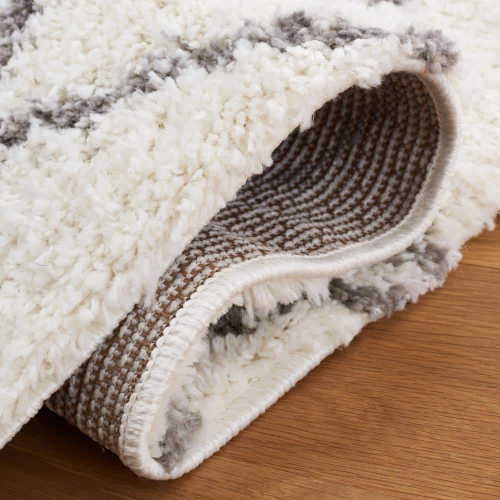 Cream and Light Grey 8' x 10' Shag Synthetic Area Rug