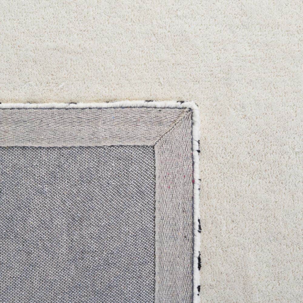 Handmade Tufted Black and Ivory Wool Area Rug 6' x 9'