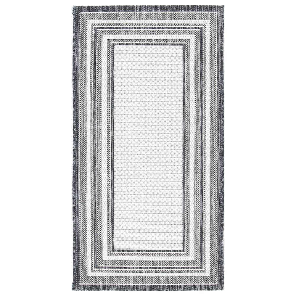 Ivory and Black Reversible Synthetic Indoor/Outdoor Rug