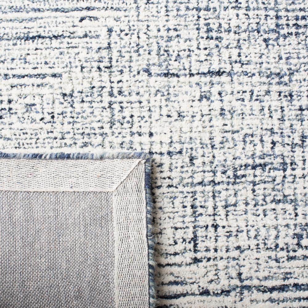 Ivory and Navy Abstract Hand-Tufted Wool Area Rug 4' x 6'