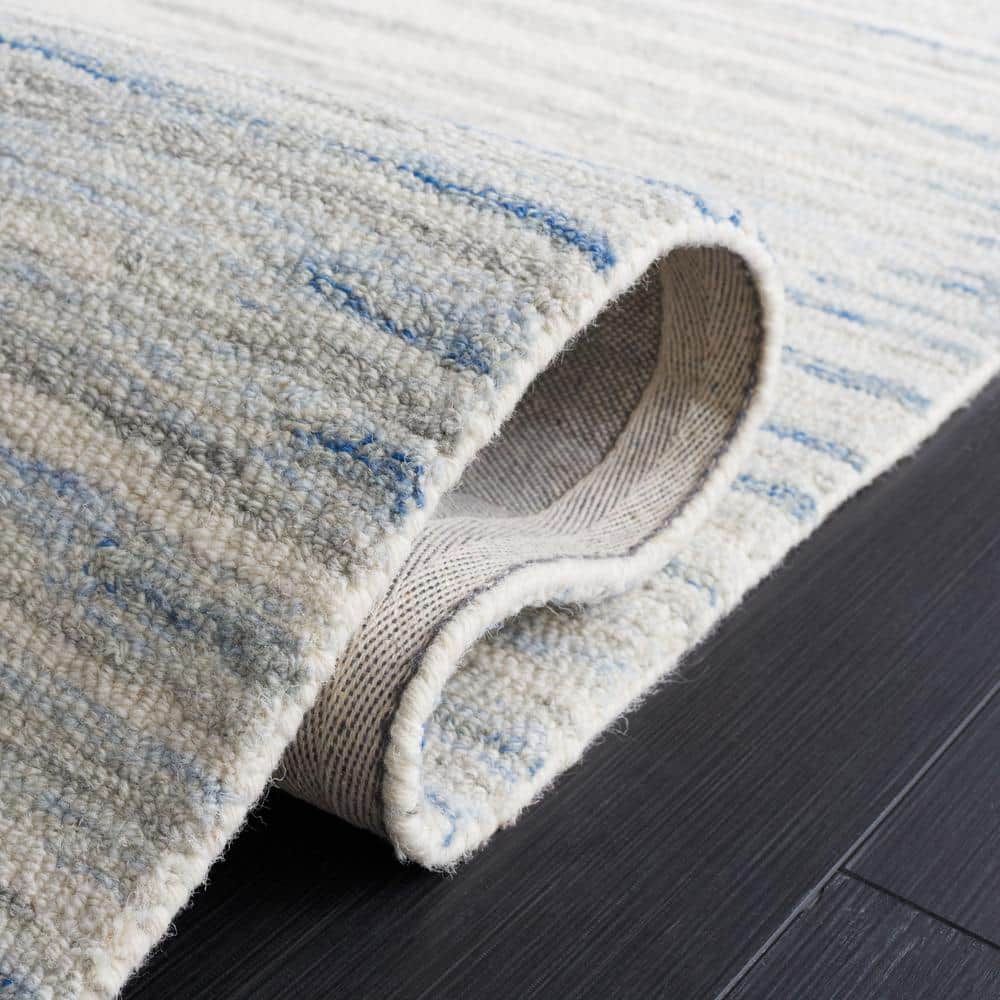 Handmade Abstract Ivory and Light Blue Wool Area Rug, 4' x 6'