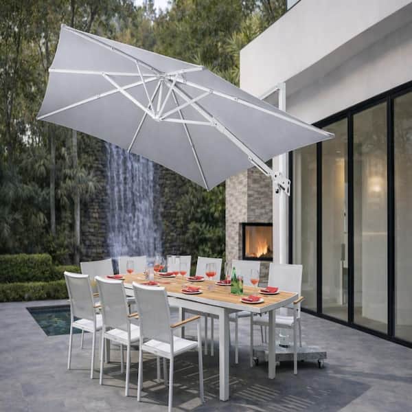 10' patio umbrella with solar lights KOTSICO 10 ft. Outdoor Market Solar Patio Umbrella with Crank, Cross Base  and LED in Navy Blue HJL10LEDXHD