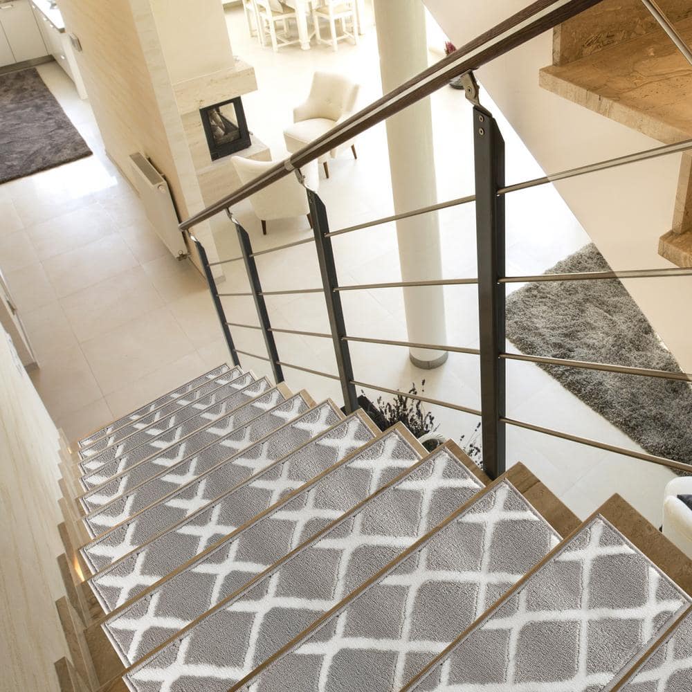 https://images.thdstatic.com/productImages/ad57a558-042d-46f3-8306-29f153414316/svn/gray-the-sofia-rugs-stair-tread-covers-stair-64b-gr-7-64_1000.jpg