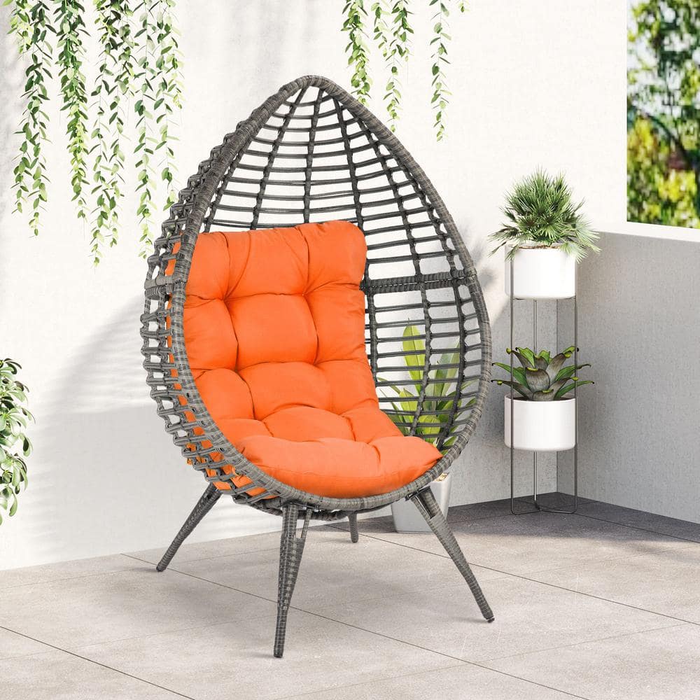 Gray Wicker Teardrop Chair with Orange Cushions