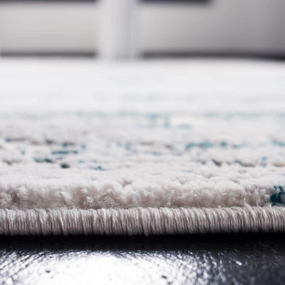 Cream and Turquoise Abstract Rectangular Area Rug 5'3" x 7'6"