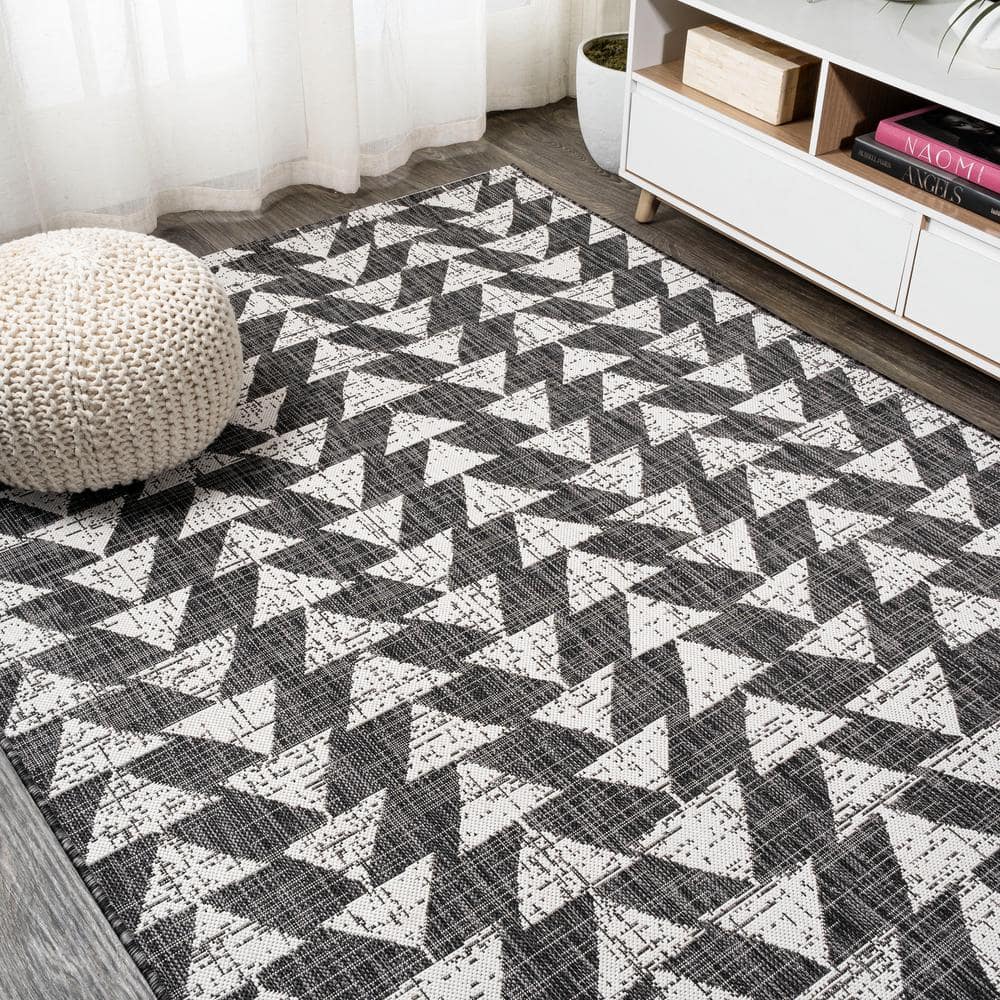 5' x 8' Black and Ivory Geometric Synthetic Area Rug