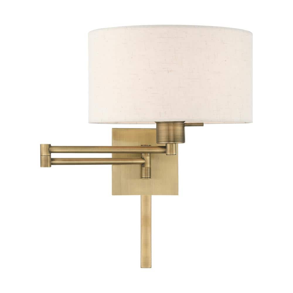 Antique Brass Swing Arm Wall Lamp with Oatmeal Shade