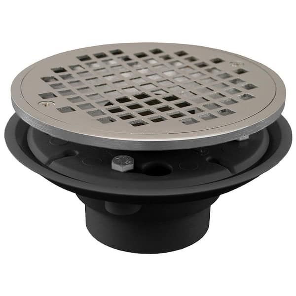 JONES STEPHENS 2 in. x 3 in. PVC Shower/Floor Drain with 2 in. Brass Spud and 6 in. Round Chrome Plated Strainer