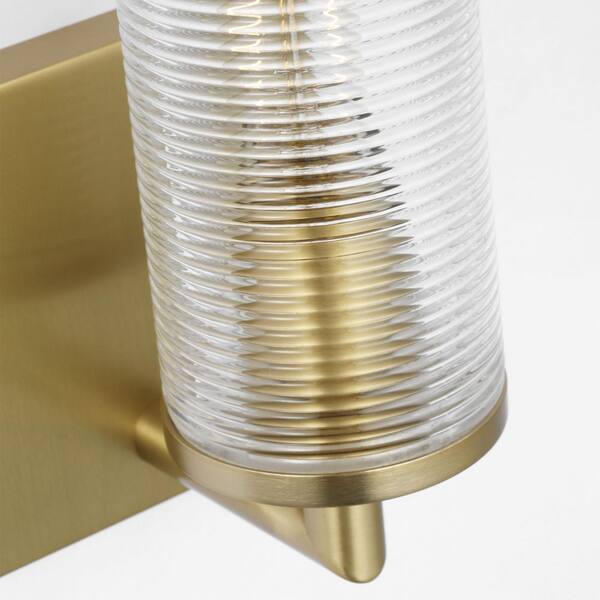 SCOTT LIVING - Sarita Small 1-Light Satin Brass Wall Sconce with Clear Ribbed Glass Shade