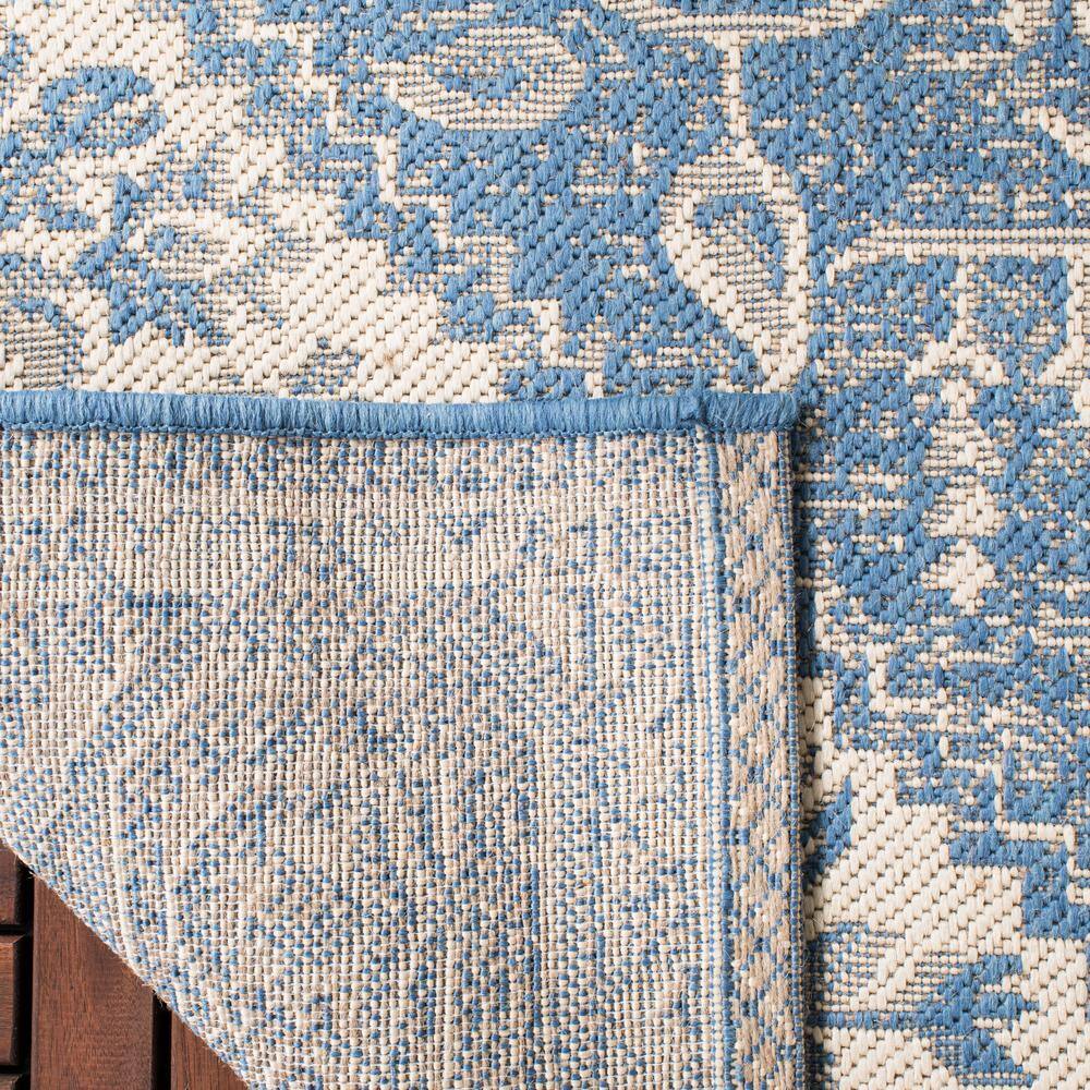 Cream and Blue Synthetic Medallion Indoor/Outdoor Area Rug