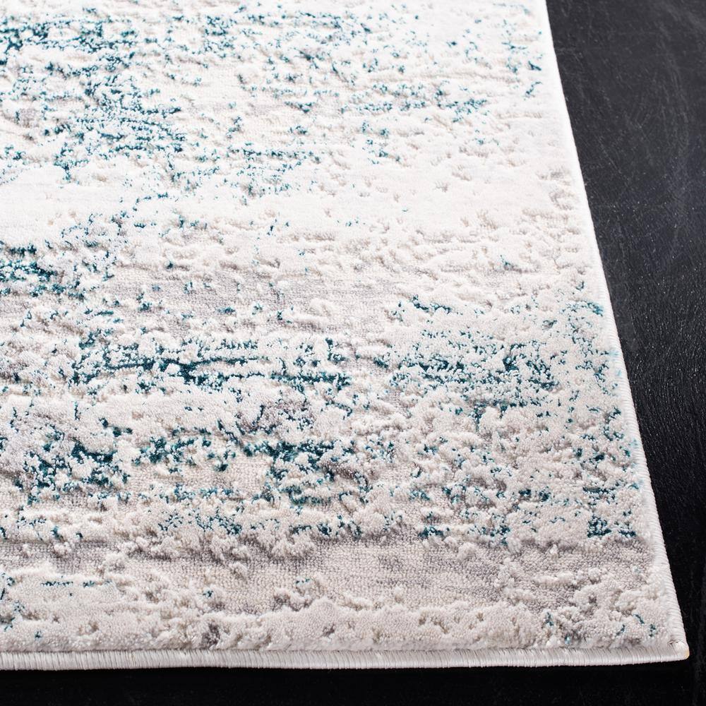 Cream and Turquoise Abstract Rectangular Area Rug 5'3" x 7'6"
