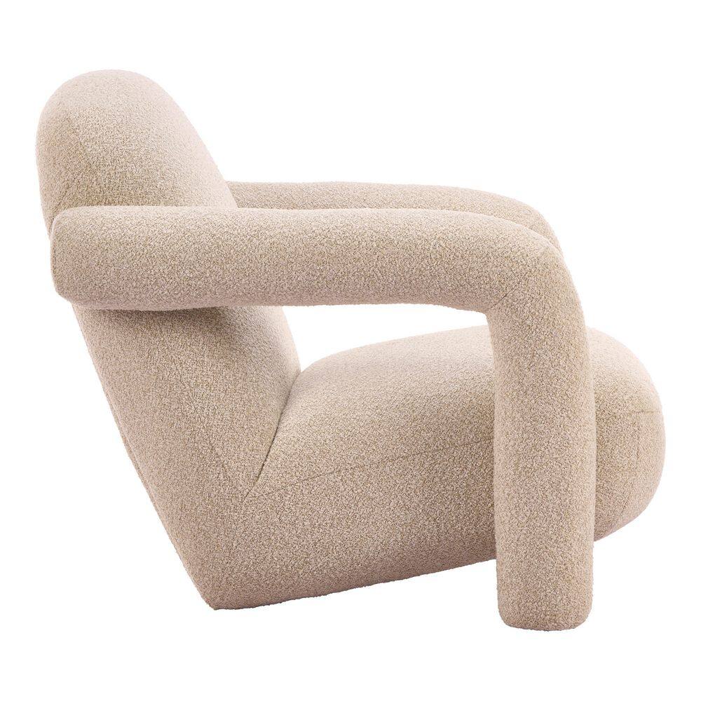Close-up of the upholstered arm and cushion of a beige accent chair.