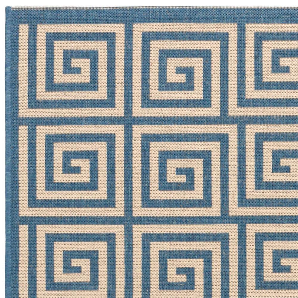 Cream and Blue Geometric 3' x 5' Stain-Resistant Synthetic Rug