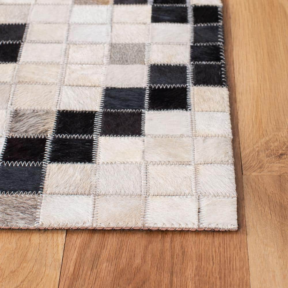 Handmade Black and White Geometric Cowhide Rug