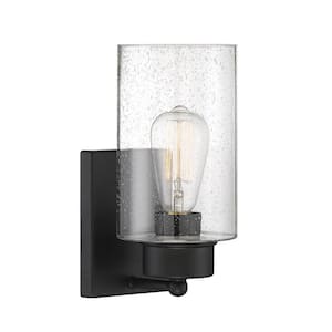 Meridian 5 in. W x 10.5 in. H 1-Light Matte Black Wall Sconce with Clear Seeded Glass Shade