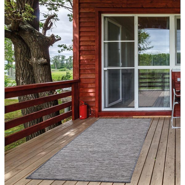 https://images.thdstatic.com/productImages/ae8b6a5a-0a6e-44ab-8a75-1f11b2ee272e/svn/gray-ottomanson-outdoor-rugs-sun2003-2x5-31_600.jpg