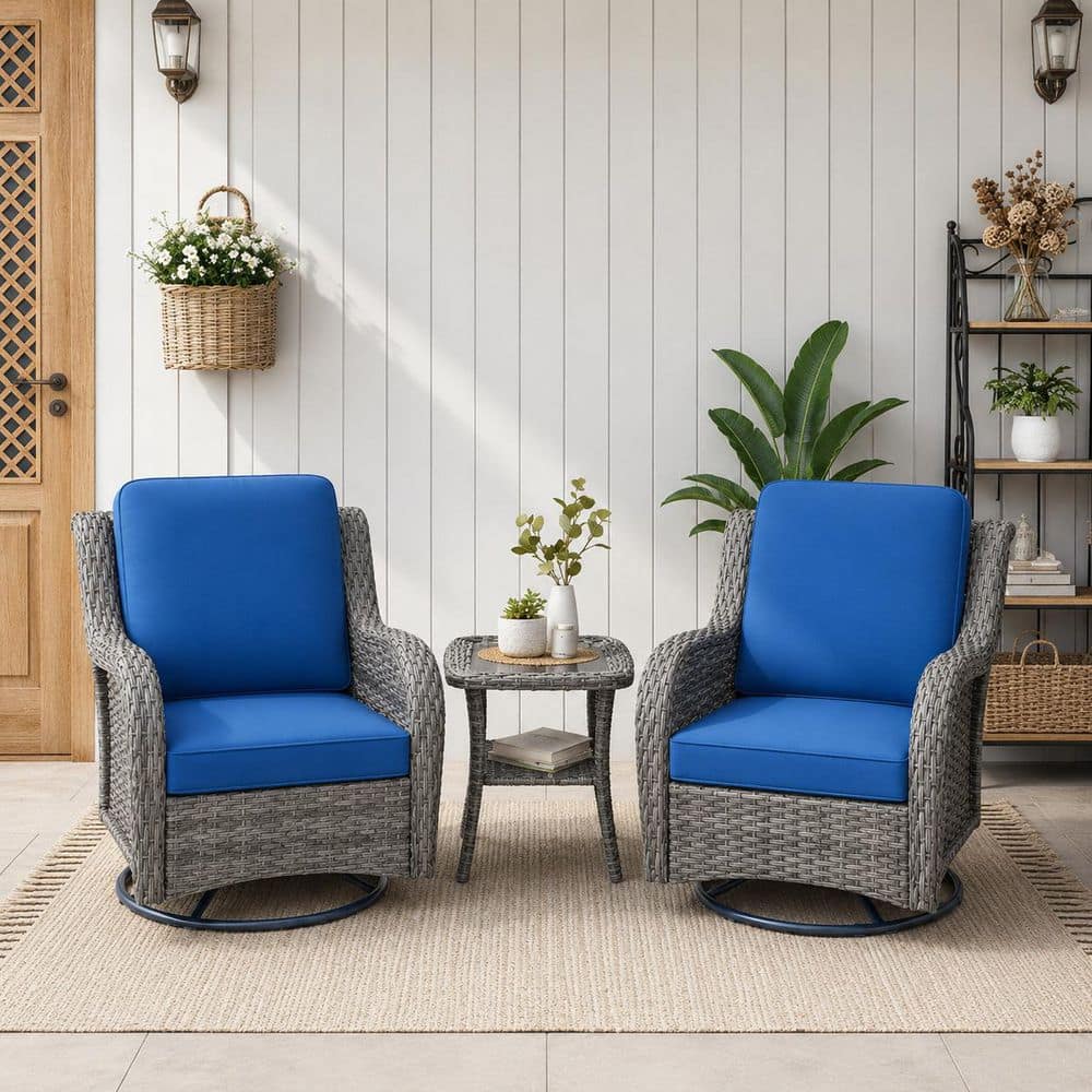 Three blue cushioned rattan armchairs on a patio with a rug.