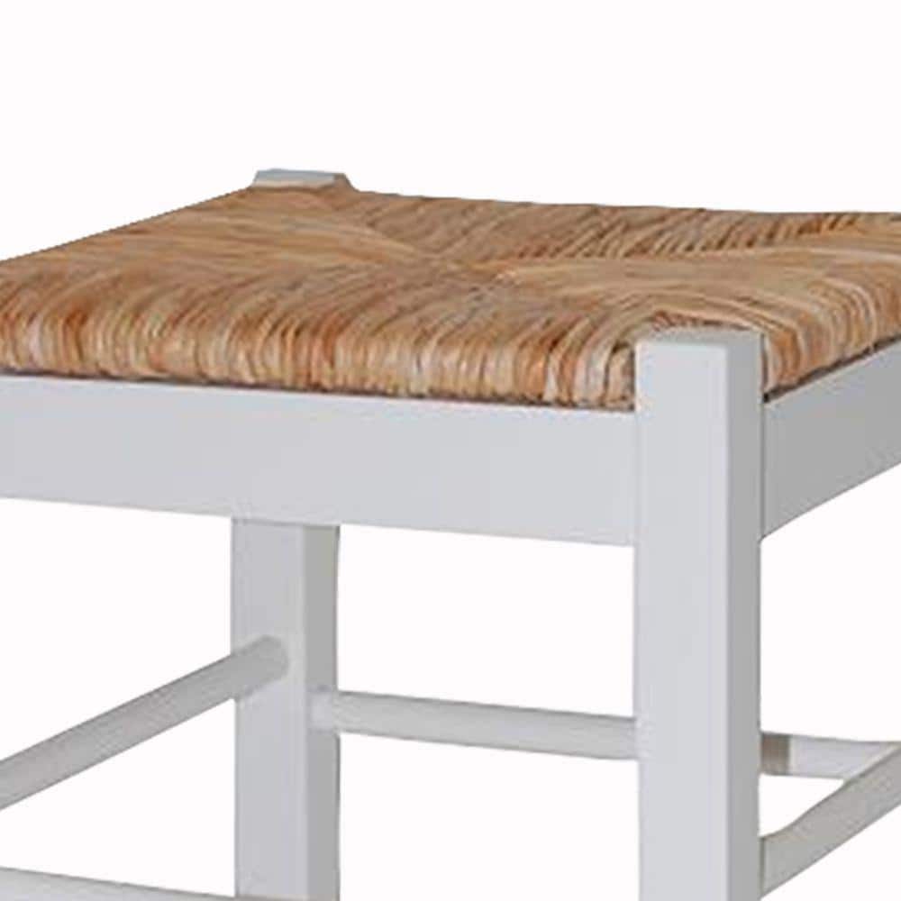 Close-up view of the woven rush seat and upper frame of a counter stool.