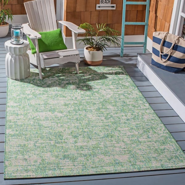 https://images.thdstatic.com/productImages/aed4f238-4893-4f79-9a83-436a79681818/svn/green-blue-ivory-safavieh-outdoor-rugs-cy8452-55721-4-e1_600.jpg