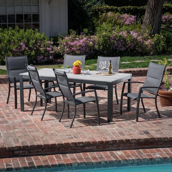 Hanover Tucson 7-Piece Aluminum Outdoor Dining Set with 6-Padded Sling Chairs and a Faux Wood Dining Table