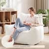 Woman sitting in bean bag chair showing support features.
