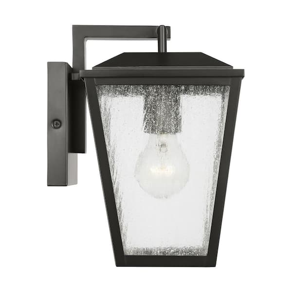 SCOTT LIVING - Kennewick 6.5 in. W x 10 in. H 1-Light Antique Bronze Outdoor Wall Lantern with Distressed Seeded Glass Shade