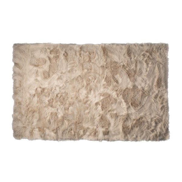 https://images.thdstatic.com/productImages/af19f503-6d03-4068-b0dd-92b88976fd6c/svn/taupe-luxe-faux-fur-area-rugs-676685053275-64_600.jpg