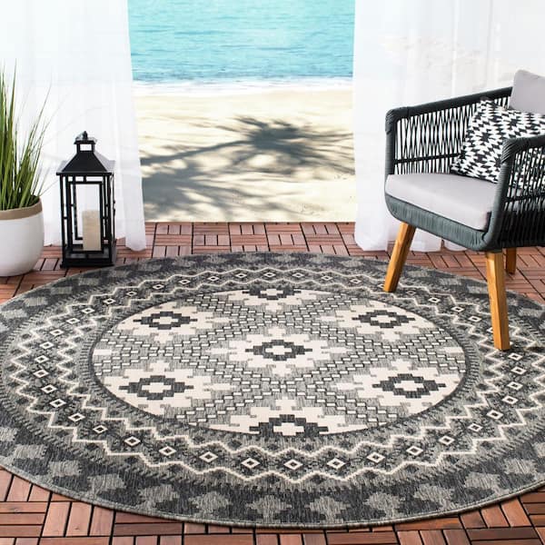 https://images.thdstatic.com/productImages/af1f80f9-5dde-4441-86de-fdf373197fe8/svn/ivory-charcoal-safavieh-outdoor-rugs-ver099-3435-3r-e1_600.jpg