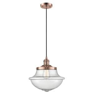 Oxford 1-Light Antique Copper Schoolhouse Pendant Light with Seedy Glass Shade