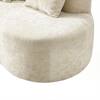 Close-up of the rounded end of the beige curved loveseat.