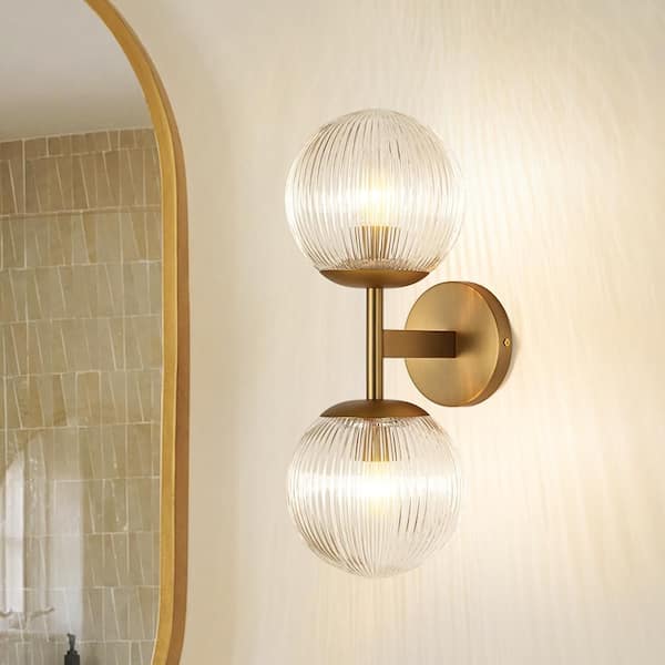 Noble 6.3 in. 2-Light Vintage Brushed Gold Vertical Design Wall Sconce with Clear Globe Ribbed Glass Shade