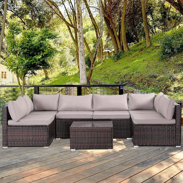 Zeus & Ruta 7-Piece Modern Rattan Wicker Garden Outdoor Sectional Set with Gray Cushions and Glass Table for Patio, Garden, Deck