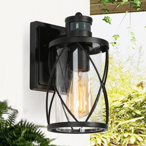 Modern Black Drum Outdoor Wall Light TORA 1-Light Motion Sensor Wall Lantern Sconce with Clear Glass Shade (1-Pack)
