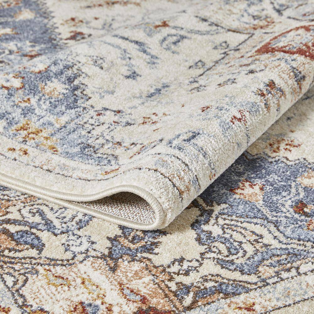 Cream and Blue 6' x 9' Synthetic Oriental Area Rug
