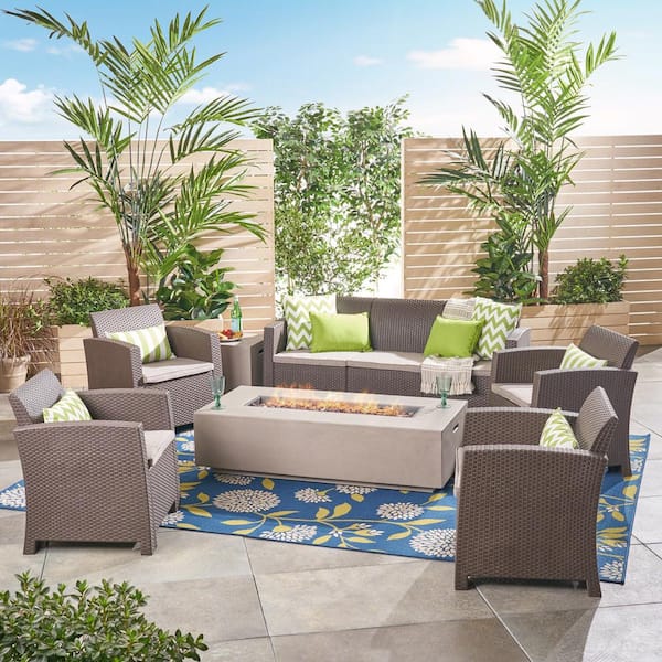 Noble House Leavitt Brown 7-Piece Faux Wicker Patio Fire Pit Conversation Set with Beige Cushions