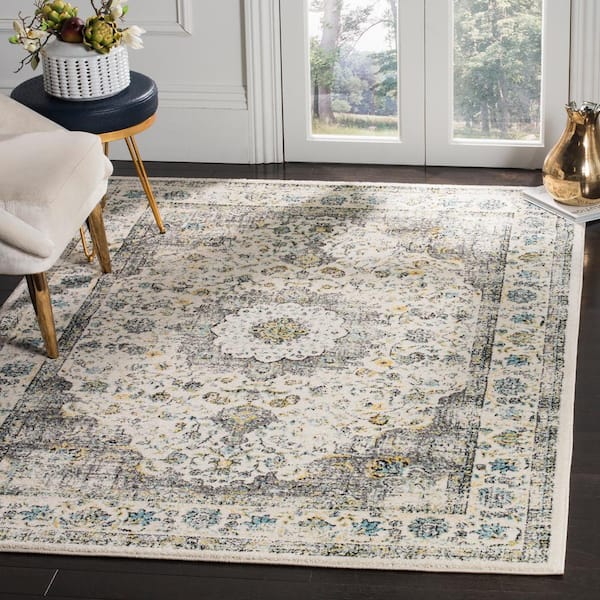 Evoke 5 ft. x 8 ft. Gray/Gold Border Area Rug