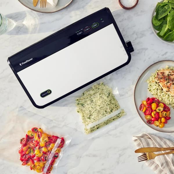 https://images.thdstatic.com/productImages/afb39531-bd4f-4069-aed0-ce703f1e18f2/svn/white-foodsaver-food-vacuum-sealers-985120302m-31_600.jpg