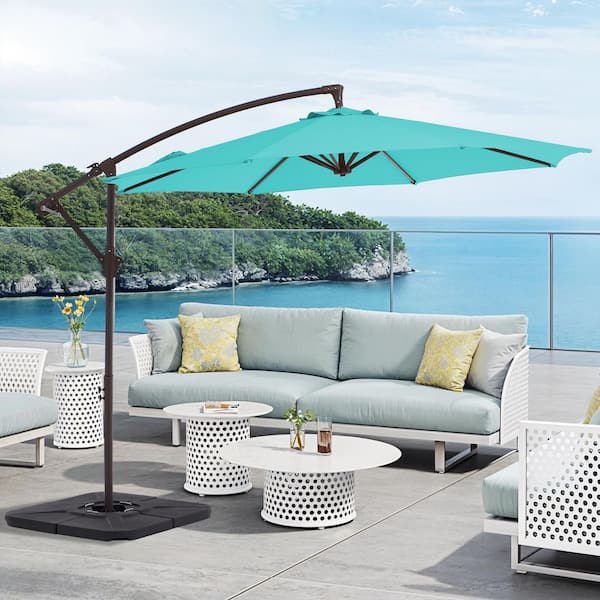 cream and natural colored patio umbrellas Sinta 9 FT. Eucalyptus Wood Market Umbrella