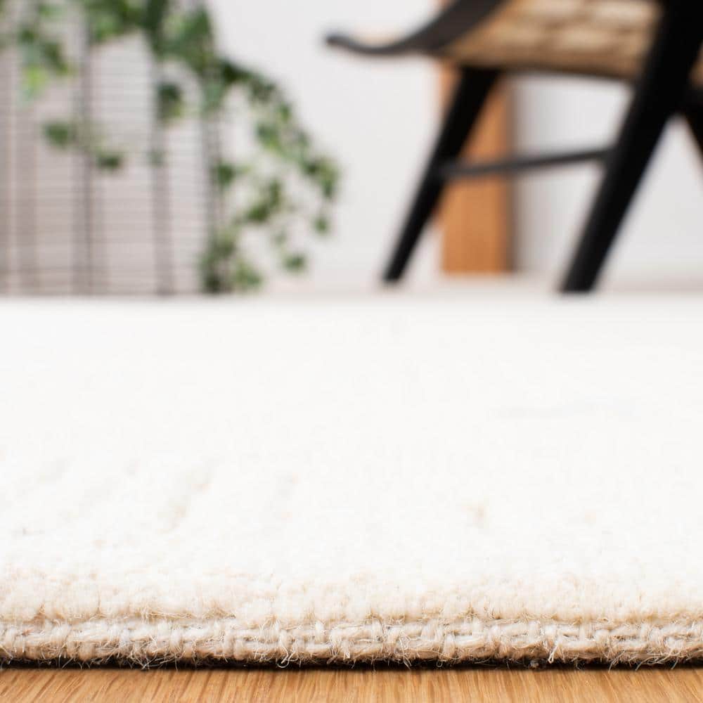 Ivory Geometric Handmade Wool Round Tufted Rug