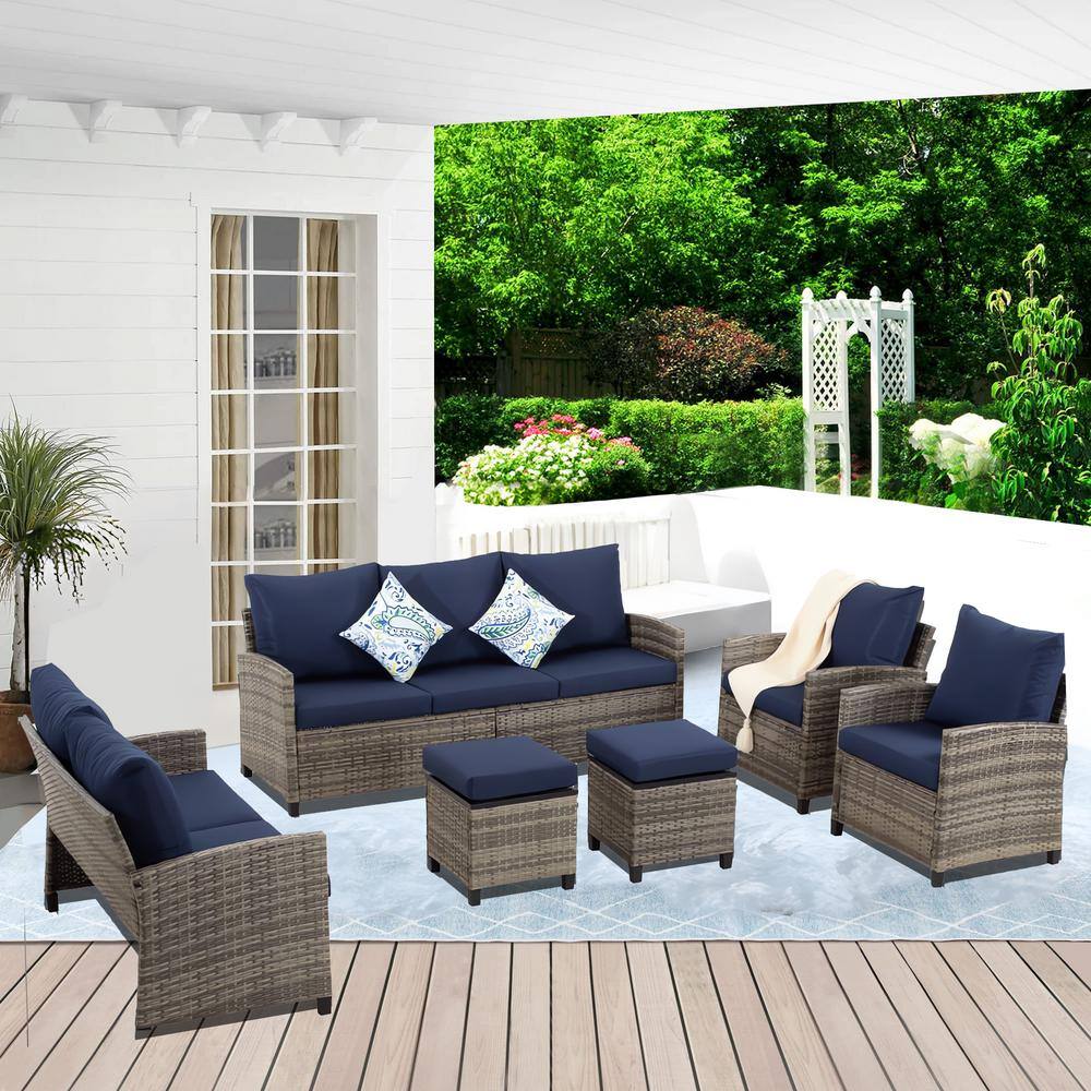5-Piece Gray Wicker Outdoor Sectional Set with Navy Blue Cushions and Ottom
