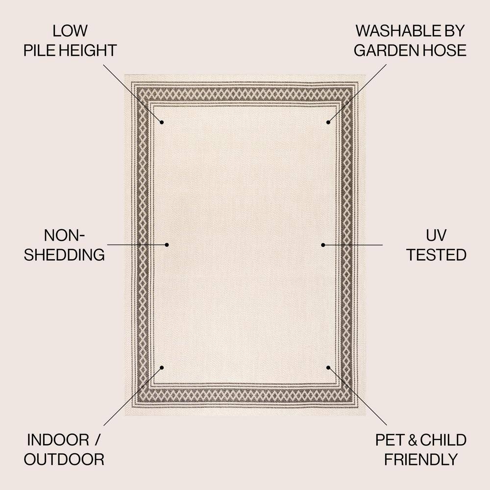 Reversible Cream and Black Diamond Geometric Synthetic Area Rug